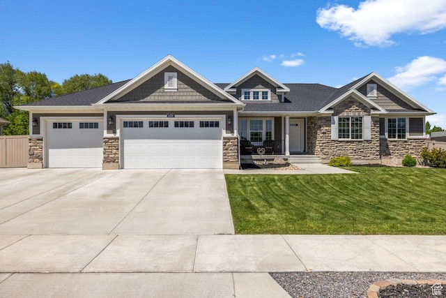 3498 W Harvestwood Ln S, Riverton, UT 84065 - craftsman-style home featuring stone siding, a front lawn, a garage, concrete driveway, and a porch