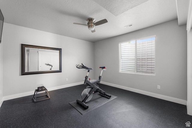 3498 W Harvestwood Ln S, Riverton, UT 84065 - workout area with ceiling fan, a textured ceiling, and baseboards