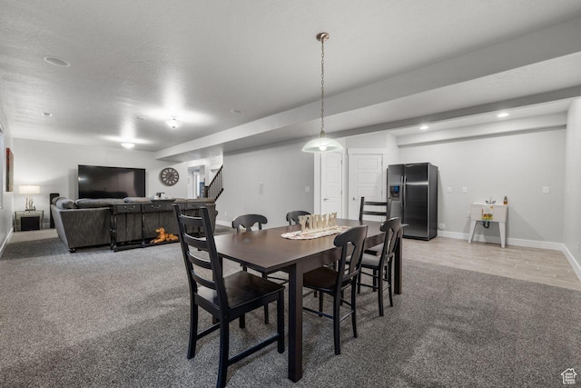 3498 W Harvestwood Ln S, Riverton, UT 84065 - dining area with light colored carpet, baseboards, stairway, and recessed lighting