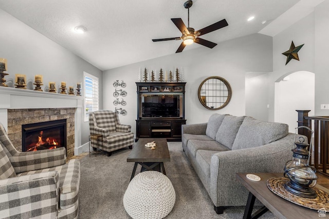 3498 W Harvestwood Ln S, Riverton, UT 84065 - carpeted living room with lofted ceiling, ceiling fan, a fireplace, arched walkways, and recessed lighting