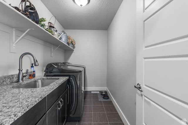 3498 W Harvestwood Ln S, Riverton, UT 84065 - laundry room with independent washer and dryer, cabinet space, baseboards, and a textured ceiling