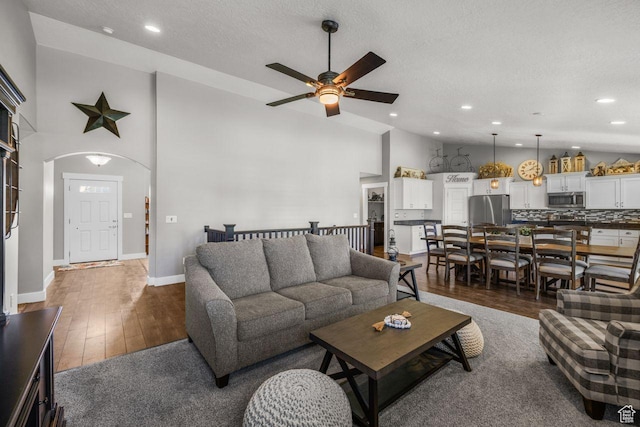 3498 W Harvestwood Ln S, Riverton, UT 84065 - living area with ceiling fan, arched walkways, a textured ceiling, dark wood finished floors, and recessed lighting