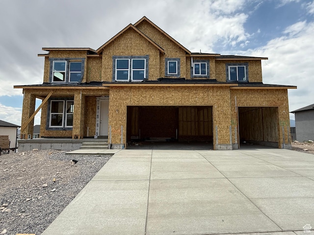 4171 N Ophir Dr Unit 408, Eagle Mountain, UT 84005 - view of front of property with an attached garage, concrete driveway, and a porch