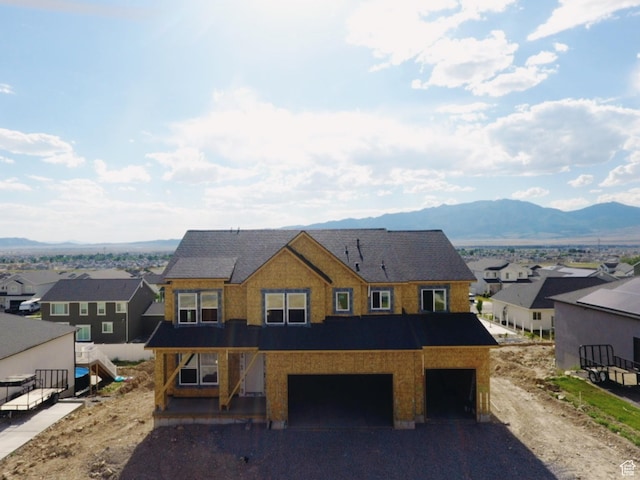 4171 N Ophir Dr Unit 408, Eagle Mountain, UT 84005 - unfinished property featuring an attached garage, a residential view, a mountain view, and asphalt driveway