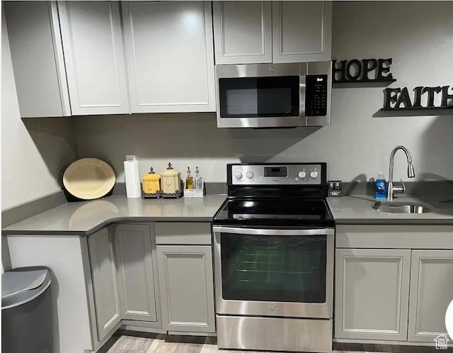 4254 E Center Point St, Eagle Mountain, UT 84005 - kitchen with stainless steel appliances, a sink, and light countertops
