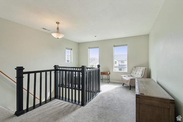 4254 E Center Point St, Eagle Mountain, UT 84005 - hallway with an upstairs landing, light colored carpet, and baseboards