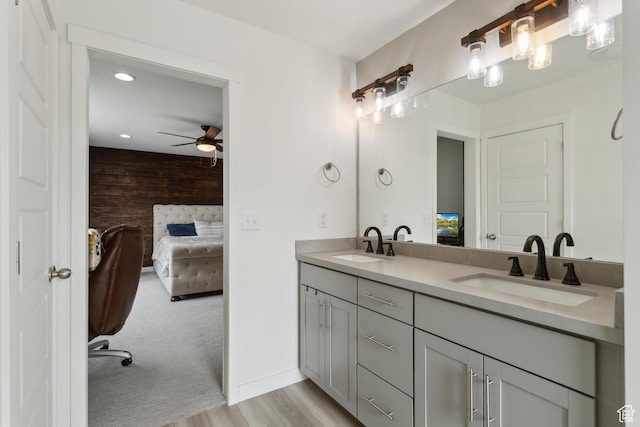 4254 E Center Point St, Eagle Mountain, UT 84005 - ensuite bathroom with double vanity, wooden walls, a ceiling fan, wood finished floors, and recessed lighting