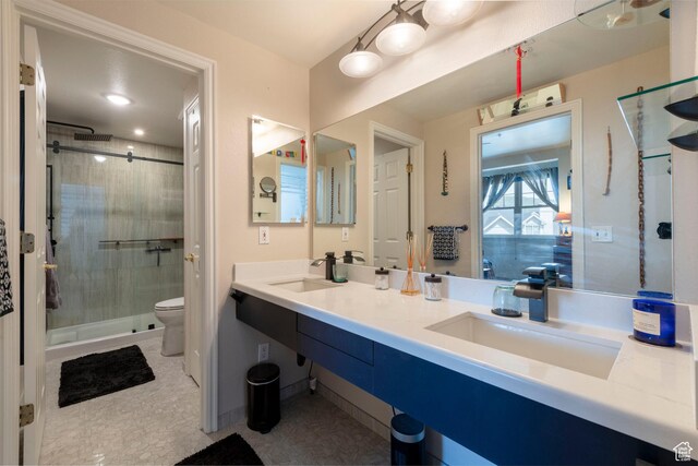 900 Bitner Rd Unit B37, Park City, UT 84098 - bathroom featuring toilet, a stall shower, and double vanity