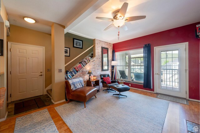 900 Bitner Rd Unit B37, Park City, UT 84098 - living area featuring wood finished floors, ceiling fan, stairs, and an accent wall