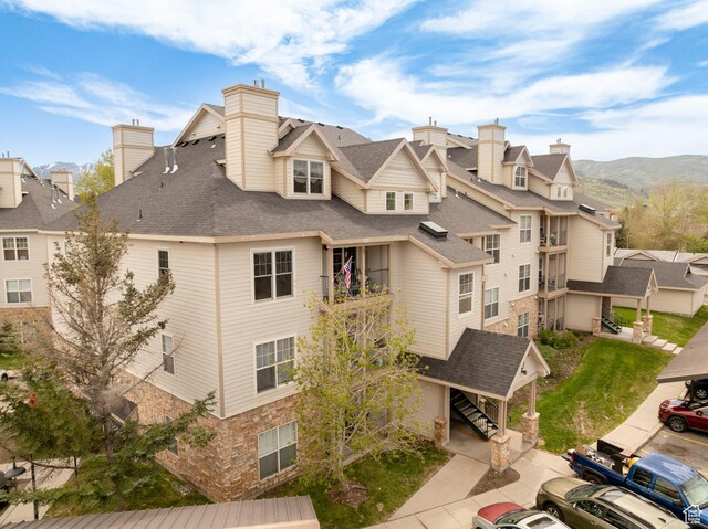 900 Bitner Rd Unit B37, Park City, UT 84098 - view of building exterior with a residential view, stairs, and a mountain view
