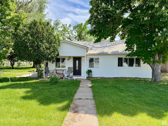30 E 300 S, Fillmore, UT 84631 - ranch-style house with a front lawn and a porch