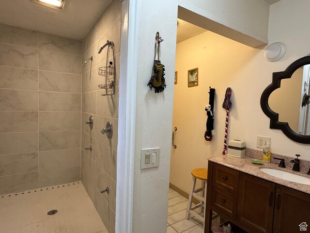 30 E 300 S, Fillmore, UT 84631 - bathroom featuring vanity, tiled shower, and tile patterned floors
