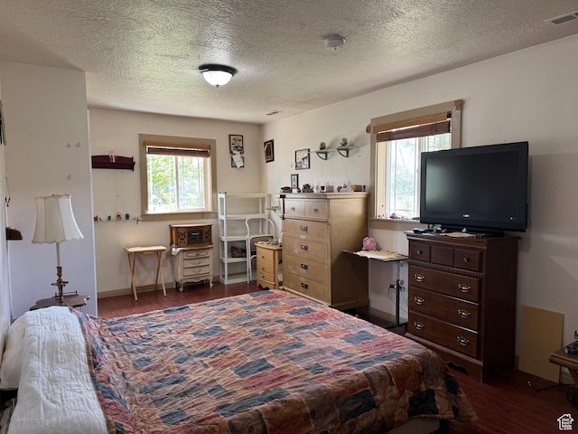 30 E 300 S, Fillmore, UT 84631 - bedroom featuring dark wood-style flooring and a textured ceiling