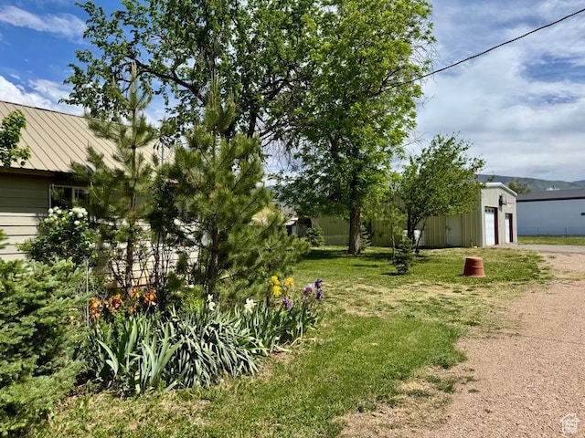 30 E 300 S, Fillmore, UT 84631 - view of yard featuring an outbuilding, driveway, and a garage
