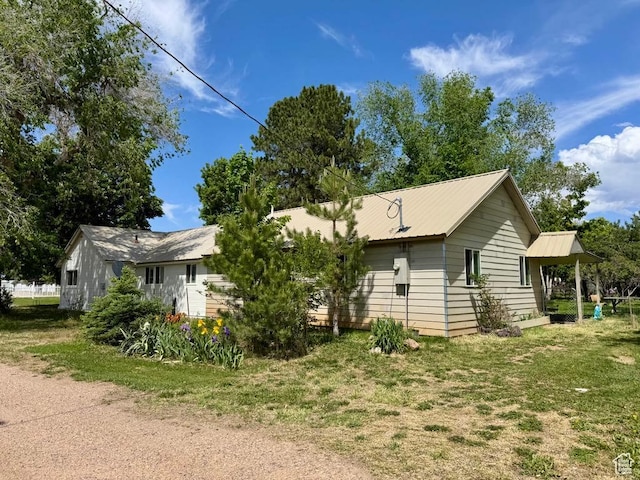 30 E 300 S, Fillmore, UT 84631 - view of front of house featuring metal roof and a front yard