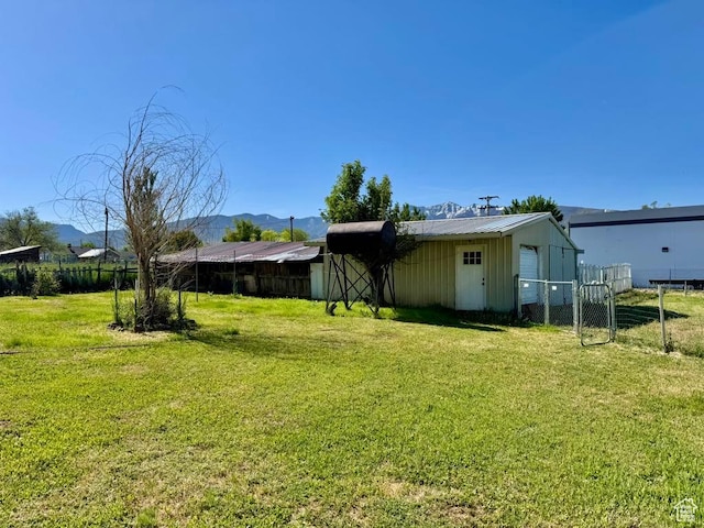 30 E 300 S, Fillmore, UT 84631 - view of yard featuring a mountain view, an outbuilding, and a gate