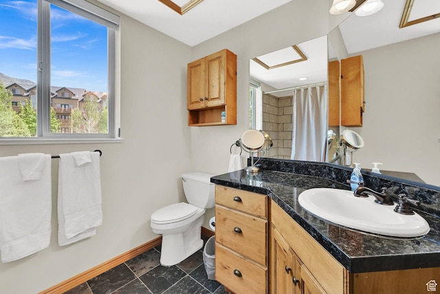 5063 E Lakeview Dr Unit 1001, Eden, UT 84310 - full bath featuring baseboards, vanity, toilet, and plenty of natural light