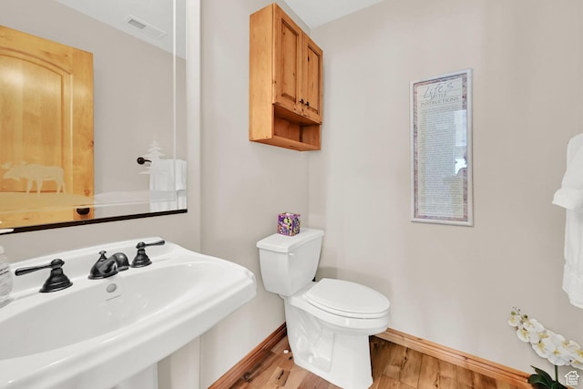 5063 E Lakeview Dr Unit 1001, Eden, UT 84310 - bathroom with a sink, toilet, wood finished floors, and baseboards