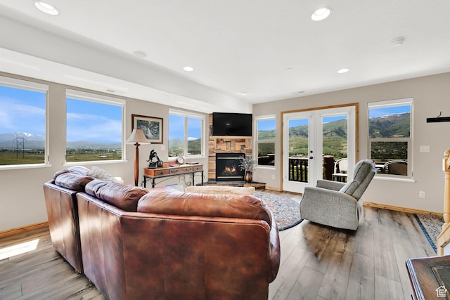 5063 E Lakeview Dr Unit 1001, Eden, UT 84310 - living room featuring light wood-type flooring, a fireplace, baseboards, recessed lighting, and french doors