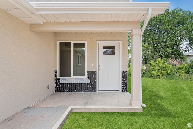 1615 N Angel St Unit D, Layton, UT 84041 - doorway to property with a lawn and stucco siding