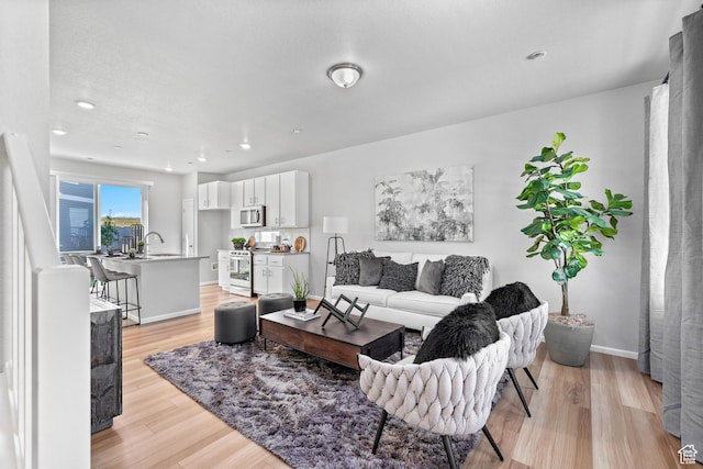 383 N Colonnade Rd Unit 1013, Saratoga Springs, UT 84045 - living area with light wood-style flooring, baseboards, and recessed lighting
