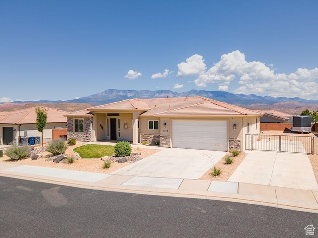 2738 W 270 N, Hurricane, UT 84737 - single story home featuring stone siding, a gate, and a mountain view