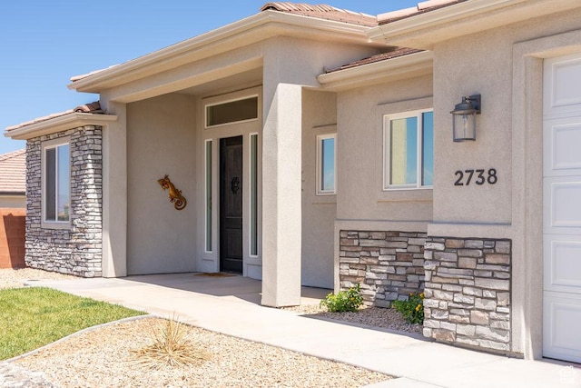 2738 W 270 N, Hurricane, UT 84737 - property entrance featuring stone siding, stucco siding, and a tile roof