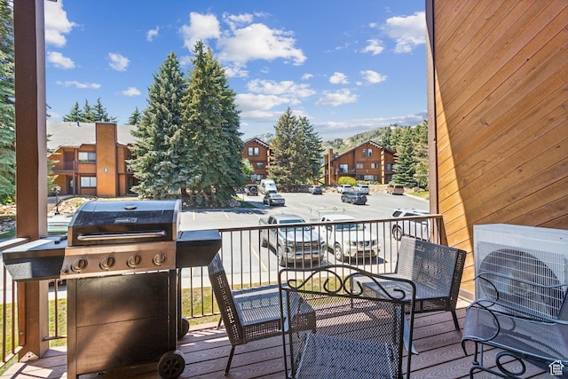 2025 Canyons Resort Dr Unit B7, Park City, UT 84098 - wooden deck featuring area for grilling, a cooling unit, and a residential view