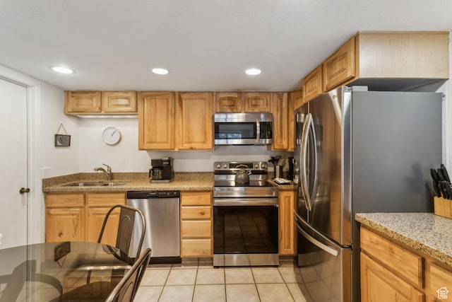 2025 Canyons Resort Dr Unit B7, Park City, UT 84098 - kitchen featuring appliances with stainless steel finishes, a sink, light stone counters, recessed lighting, and light tile patterned floors