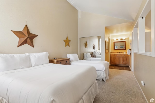 2025 Canyons Resort Dr Unit B7, Park City, UT 84098 - bedroom with carpet flooring, vaulted ceiling, connected bathroom, and baseboards