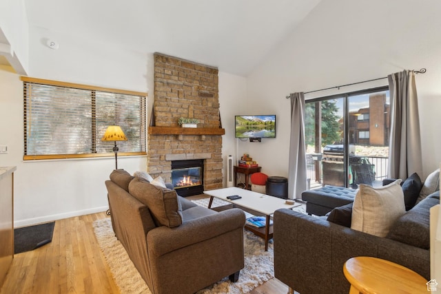 2025 Canyons Resort Dr Unit B7, Park City, UT 84098 - living room featuring wood finished floors, high vaulted ceiling, a fireplace, and baseboards