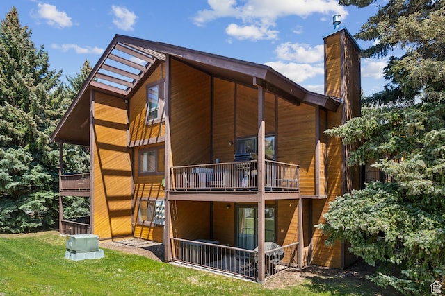 2025 Canyons Resort Dr Unit B7, Park City, UT 84098 - back of house featuring a chimney, a balcony, and a yard