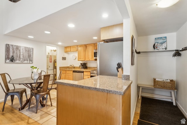 2025 Canyons Resort Dr Unit B7, Park City, UT 84098 - kitchen featuring light brown cabinetry, appliances with stainless steel finishes, a sink, recessed lighting, and a peninsula
