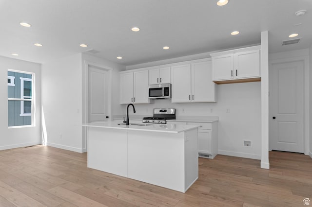 3931 W Red Clover Dr, Lehi, UT 84043 - kitchen featuring appliances with stainless steel finishes, a sink, baseboards, white cabinetry, and recessed lighting