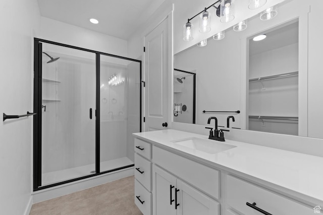 3931 W Red Clover Dr, Lehi, UT 84043 - bathroom with a stall shower, vanity, a walk in closet, and recessed lighting