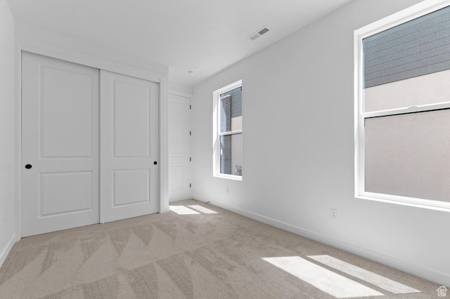 3931 W Red Clover Dr, Lehi, UT 84043 - unfurnished bedroom with carpet floors, a closet, and baseboards