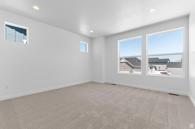 3931 W Red Clover Dr, Lehi, UT 84043 - unfurnished room with light carpet, baseboards, and recessed lighting