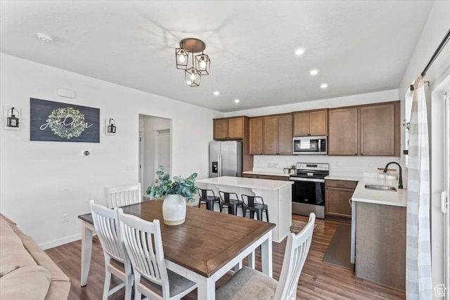 742 E Stonebriar Dr, Eagle Mountain, UT 84005 - dining area featuring dark wood finished floors, recessed lighting, and baseboards