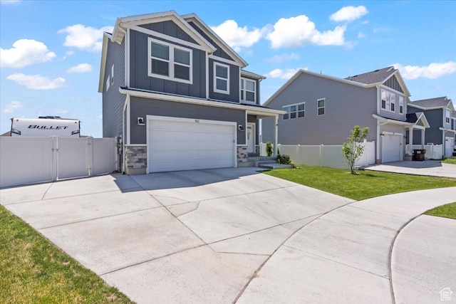 742 E Stonebriar Dr, Eagle Mountain, UT 84005 - view of front of home with board and batten siding, a garage, driveway, a gate, and stone siding