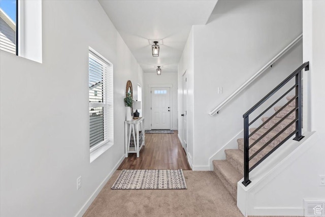 742 E Stonebriar Dr, Eagle Mountain, UT 84005 - carpeted foyer entrance featuring stairway and baseboards