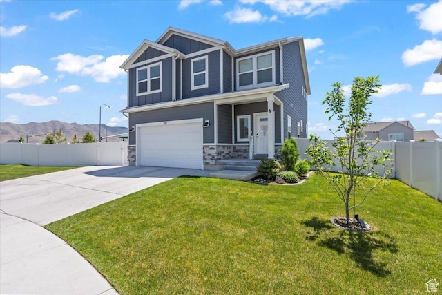 742 E Stonebriar Dr, Eagle Mountain, UT 84005 - craftsman-style house with board and batten siding, driveway, stone siding, an attached garage, and a mountain view