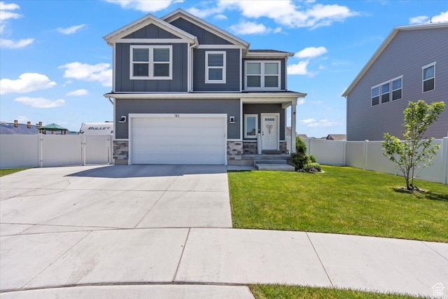 742 E Stonebriar Dr, Eagle Mountain, UT 84005 - view of front of house featuring board and batten siding, a gate, driveway, and stone siding