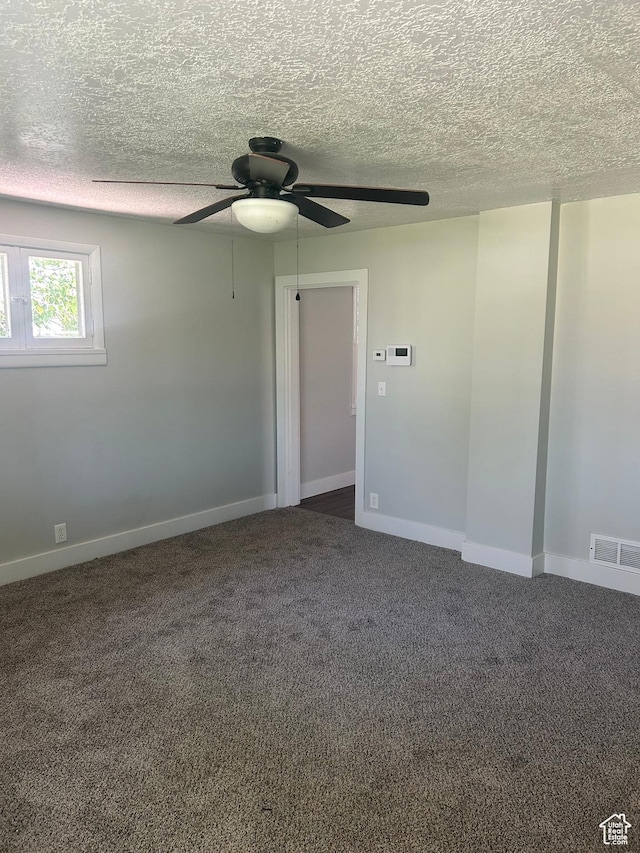 3042 Adams Ave, Ogden, UT 84403 - empty room featuring a ceiling fan, dark colored carpet, a textured ceiling, and baseboards