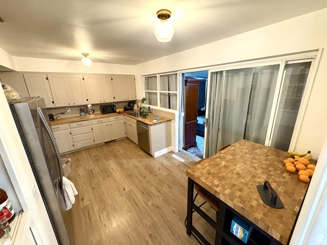 776 S Cherry Dr W, Orem, UT 84058 - kitchen featuring stainless steel appliances, light wood finished floors, white cabinets, and light countertops