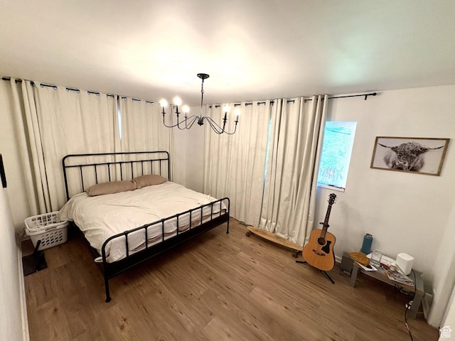 776 S Cherry Dr W, Orem, UT 84058 - bedroom with a chandelier and wood finished floors
