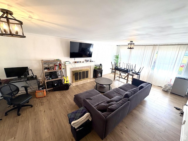 776 S Cherry Dr W, Orem, UT 84058 - living area featuring wood finished floors and a tiled fireplace
