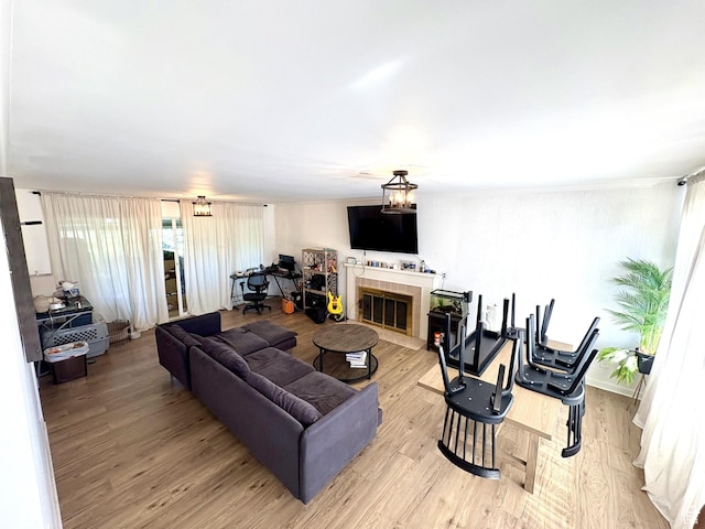 776 S Cherry Dr W, Orem, UT 84058 - living room featuring a tile fireplace and light wood-type flooring