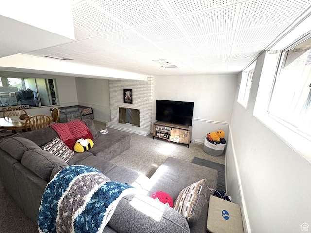 776 S Cherry Dr W, Orem, UT 84058 - living area featuring carpet flooring, baseboards, and a brick fireplace
