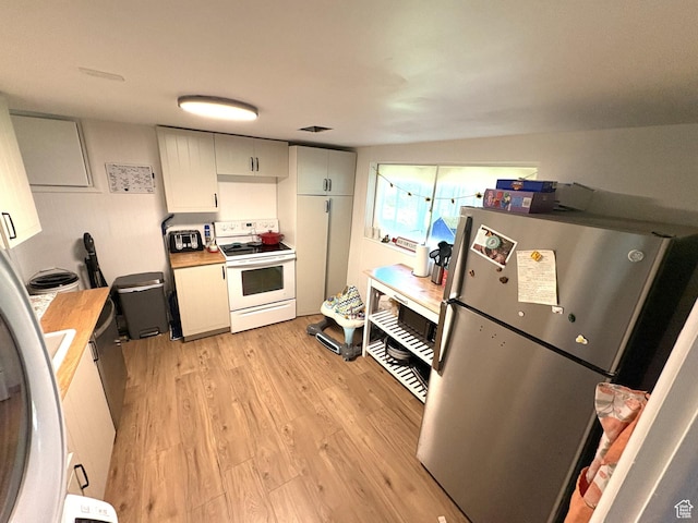 776 S Cherry Dr W, Orem, UT 84058 - kitchen featuring freestanding refrigerator, white electric range, light wood-style flooring, and light countertops