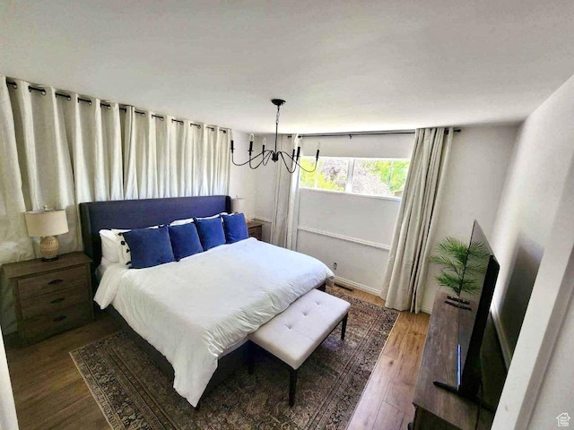 776 S Cherry Dr W, Orem, UT 84058 - bedroom featuring a chandelier and wood finished floors